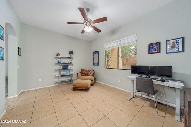 home office featuring light tile patterned floors, baseboards, and ceiling fan