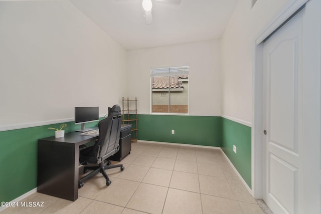 office featuring baseboards, a ceiling fan, and tile patterned floors