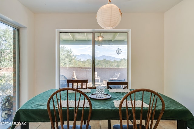 tiled dining space featuring a mountain view