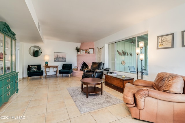 tiled living room with a fireplace