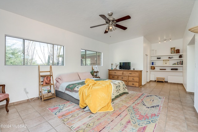 bedroom featuring ceiling fan and light tile patterned floors