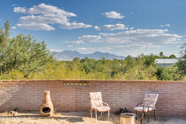 view of patio / terrace with a mountain view