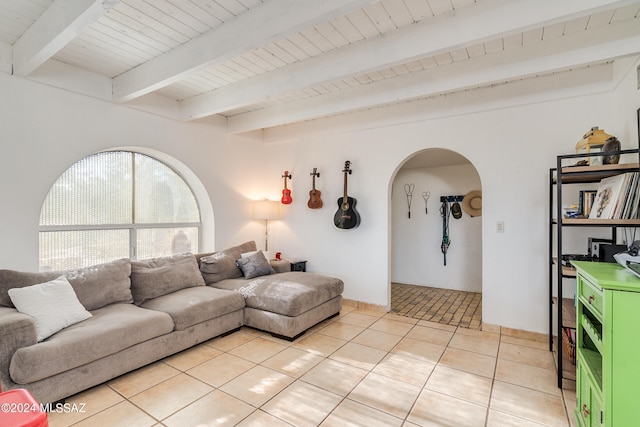 living room with beam ceiling, wooden ceiling, and light tile patterned floors