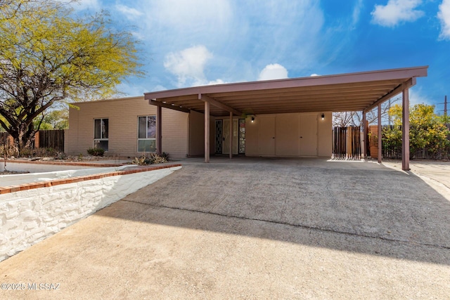 view of front of home with a carport