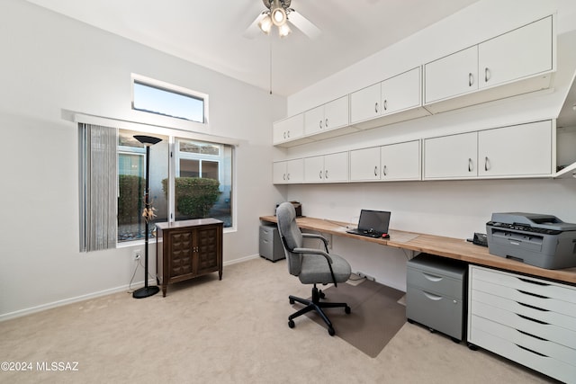 office featuring light carpet and ceiling fan