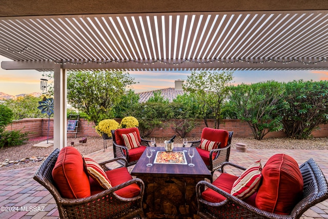 patio terrace at dusk with an outdoor fire pit