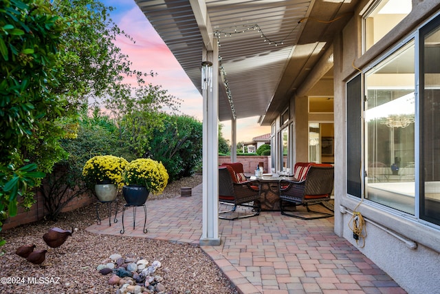 view of patio terrace at dusk