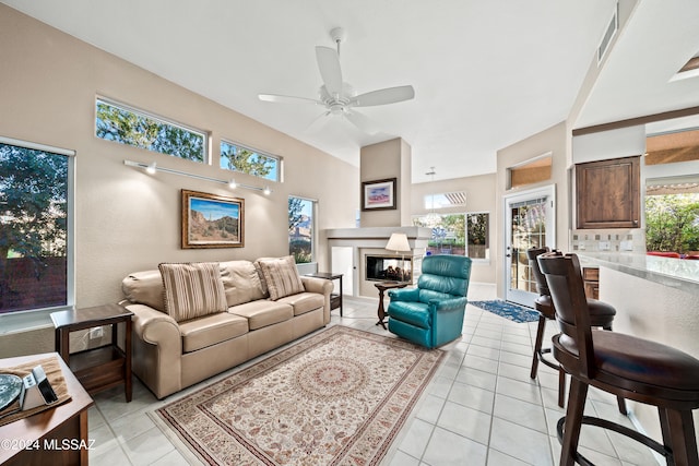 tiled living room featuring ceiling fan