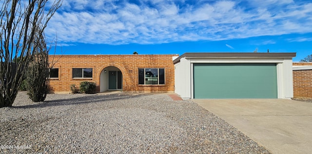 ranch-style home with a garage