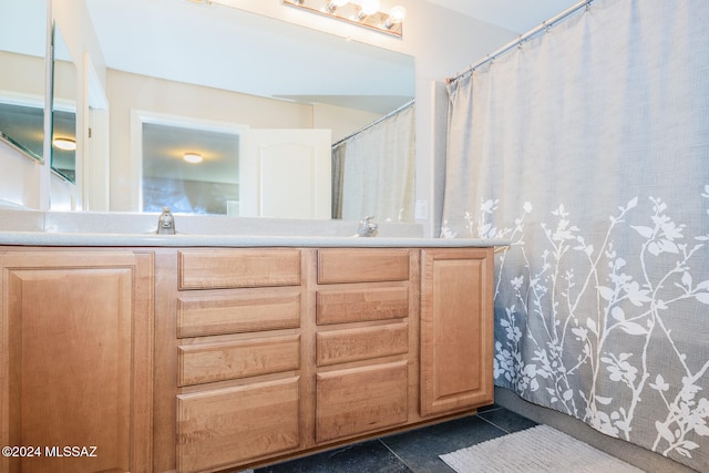 bathroom with vanity and tile patterned floors