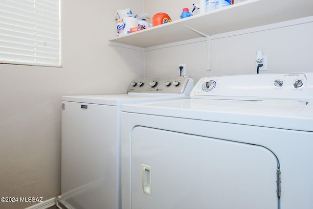 clothes washing area featuring independent washer and dryer