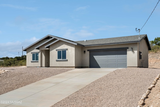 ranch-style home with a garage