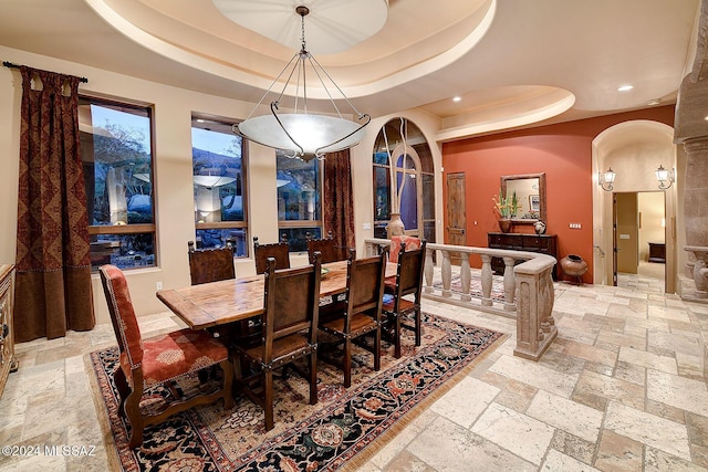 dining room featuring a tray ceiling