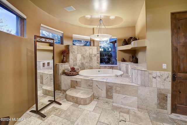 bathroom with tiled tub