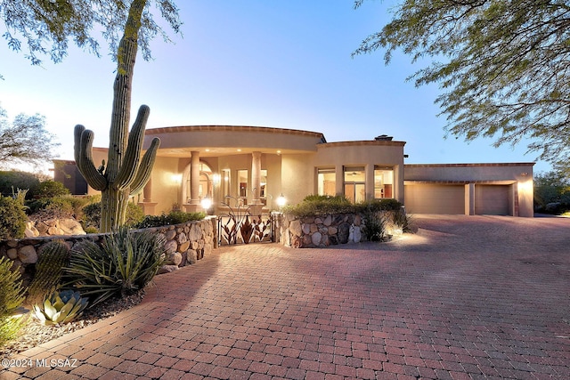 adobe home featuring a garage