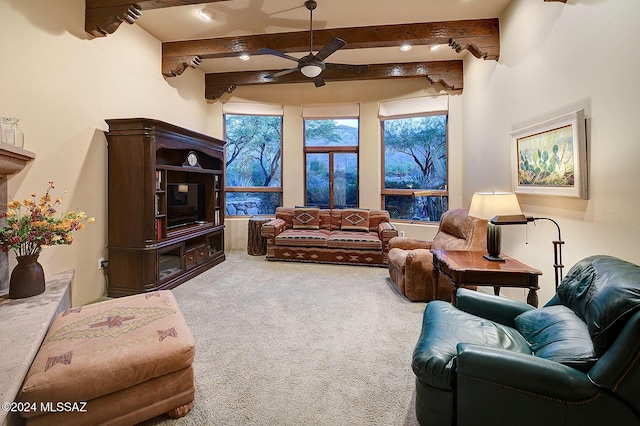 living room featuring beam ceiling, ceiling fan, and carpet