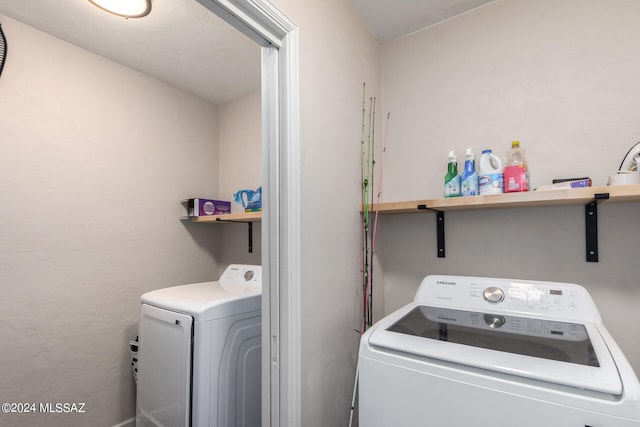 washroom with separate washer and dryer