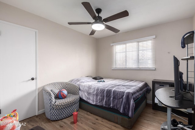 bedroom with hardwood / wood-style floors and ceiling fan