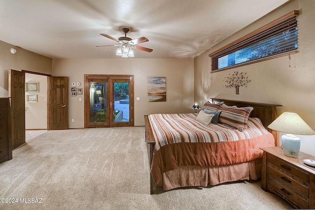 bedroom featuring ceiling fan, light colored carpet, and access to outside