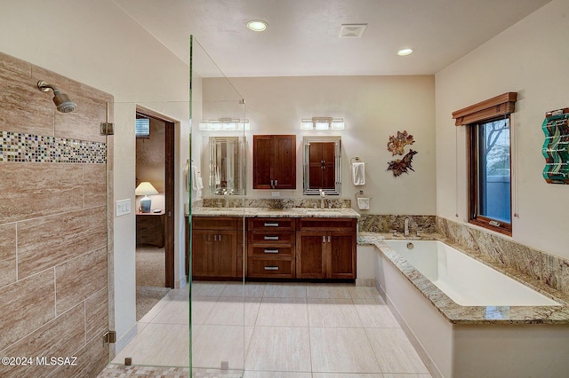 bathroom with vanity, tile patterned flooring, and separate shower and tub