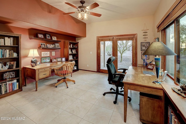 tiled home office featuring ceiling fan