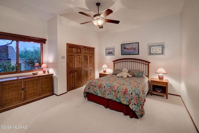 carpeted bedroom featuring ceiling fan