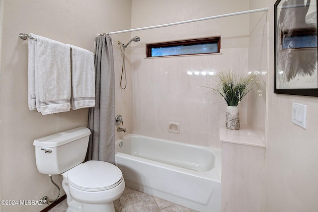 bathroom with shower / bath combo, tile patterned floors, and toilet