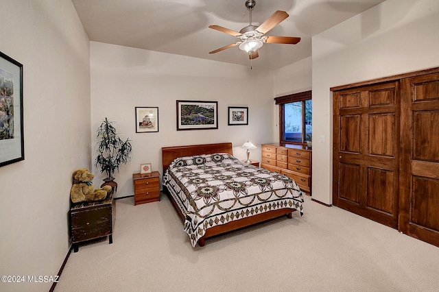 bedroom featuring ceiling fan and light colored carpet