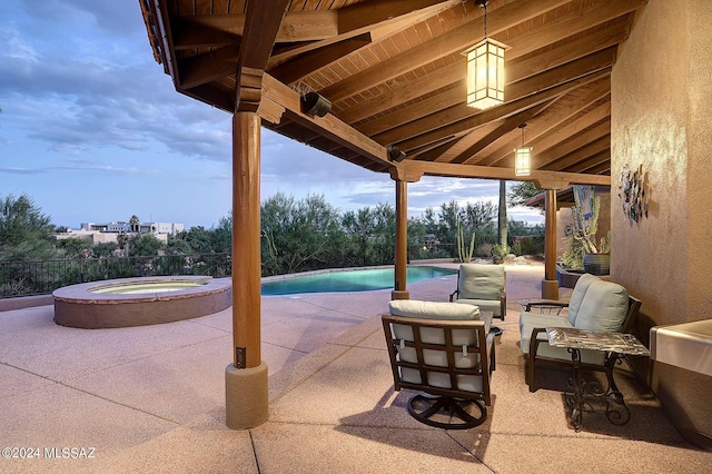 view of patio with a pool with hot tub