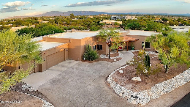 birds eye view of property with a mountain view