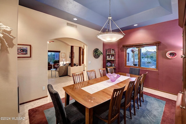 dining area featuring a tray ceiling