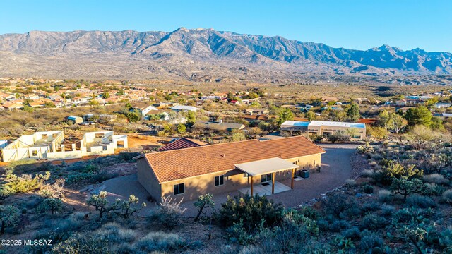 drone / aerial view featuring a mountain view