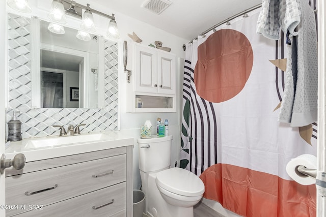 bathroom featuring vanity, a shower with shower curtain, toilet, and tasteful backsplash