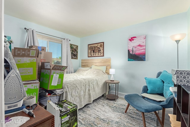 bedroom with hardwood / wood-style floors