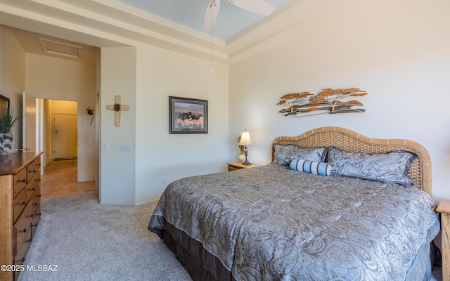 carpeted bedroom with attic access and baseboards