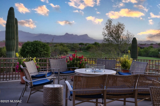 view of patio featuring outdoor dining area and a mountain view