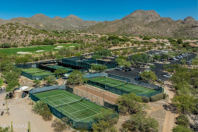 birds eye view of property with view of golf course and a mountain view