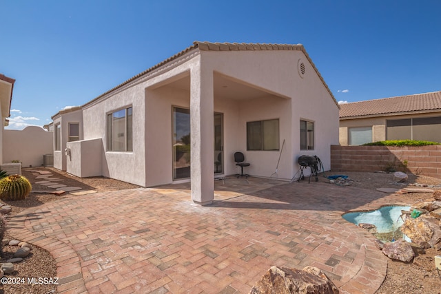 rear view of house with a patio