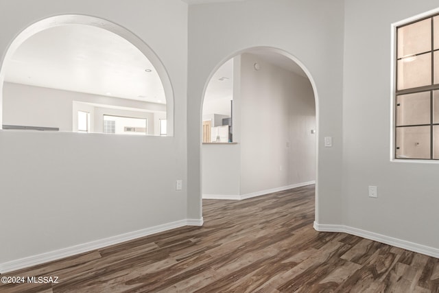 unfurnished room featuring dark hardwood / wood-style floors