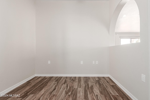 spare room featuring dark hardwood / wood-style flooring