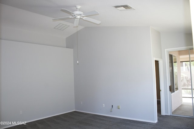 carpeted empty room featuring ceiling fan and vaulted ceiling