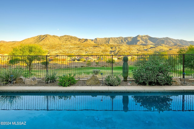 view of pool with a mountain view