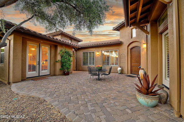 view of patio terrace at dusk