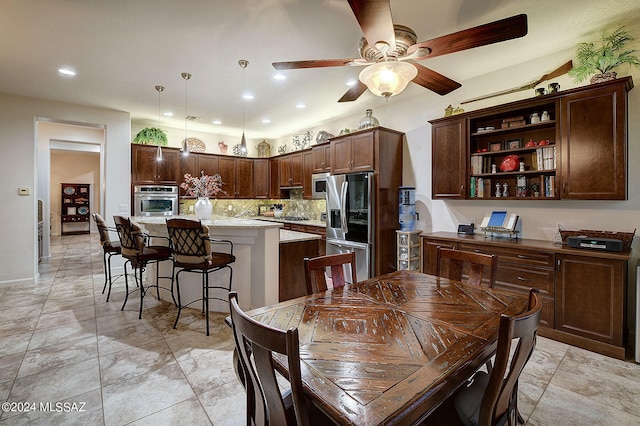 dining area with ceiling fan