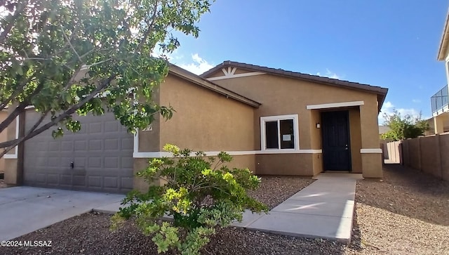 view of front of property with a garage