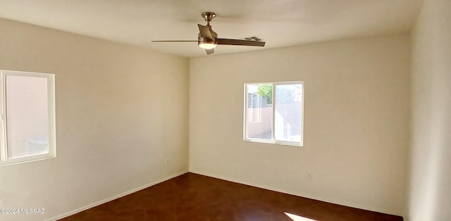 carpeted empty room featuring ceiling fan