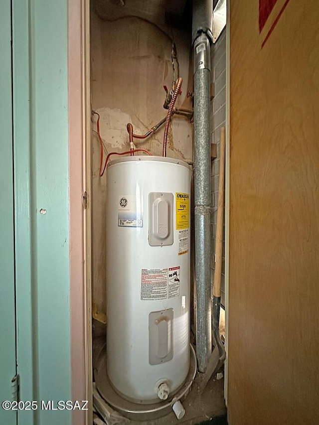 utility room featuring electric water heater