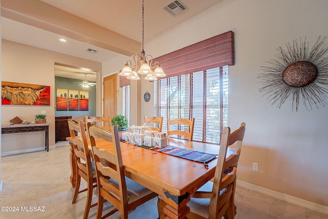 dining room with ceiling fan with notable chandelier