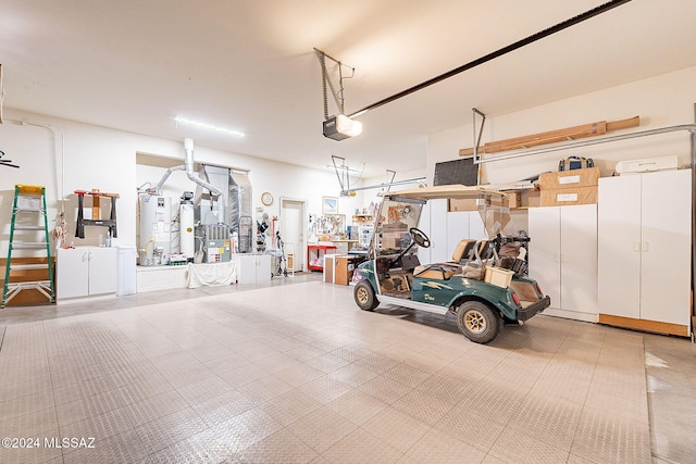 garage with a garage door opener and water heater