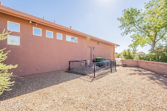 view of side of property featuring a patio area